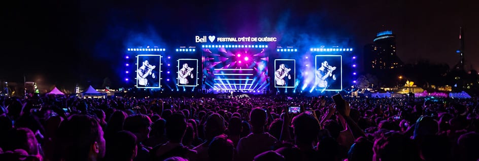 Une foule savoure le Festival d’été de Québec, qui a profité des solutions de Bell en matière de cybersécurité et de réseaux.